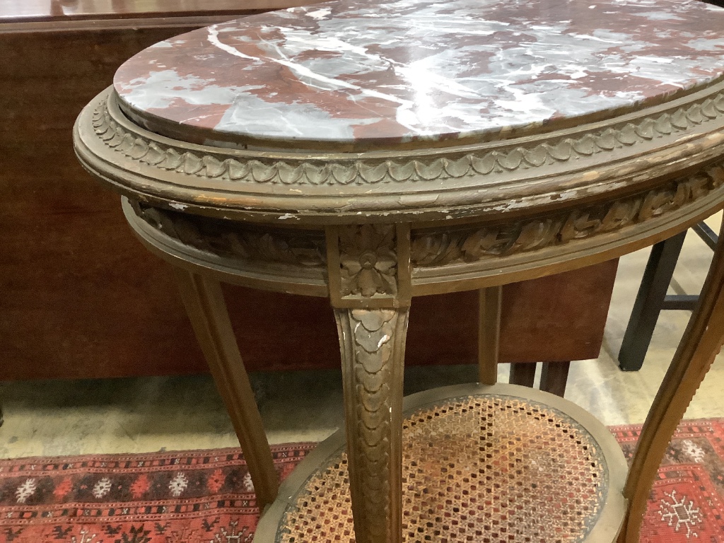 A French gilt marble topped oval table, width 56cm depth 43cm height 75cm